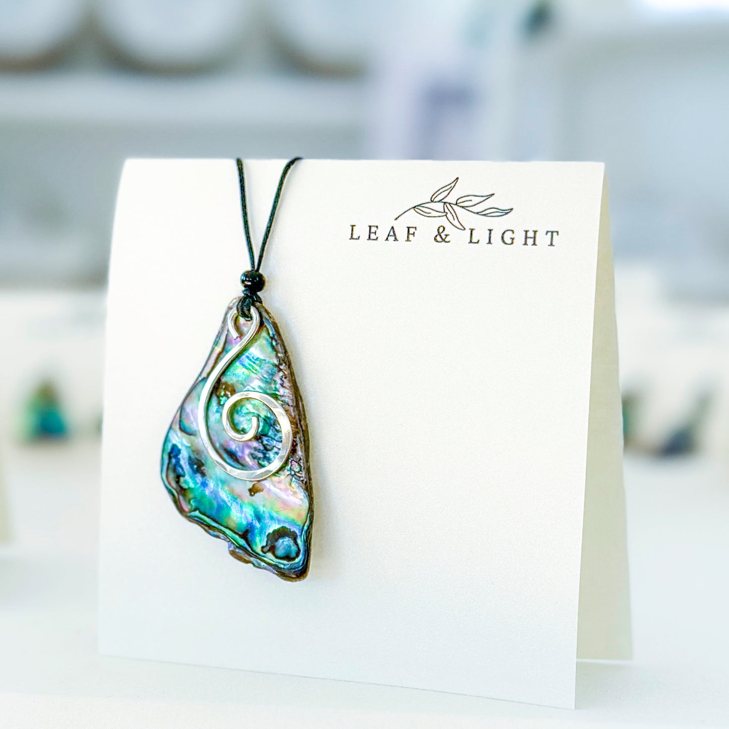 PĀUA AND STERLING NECKLACES