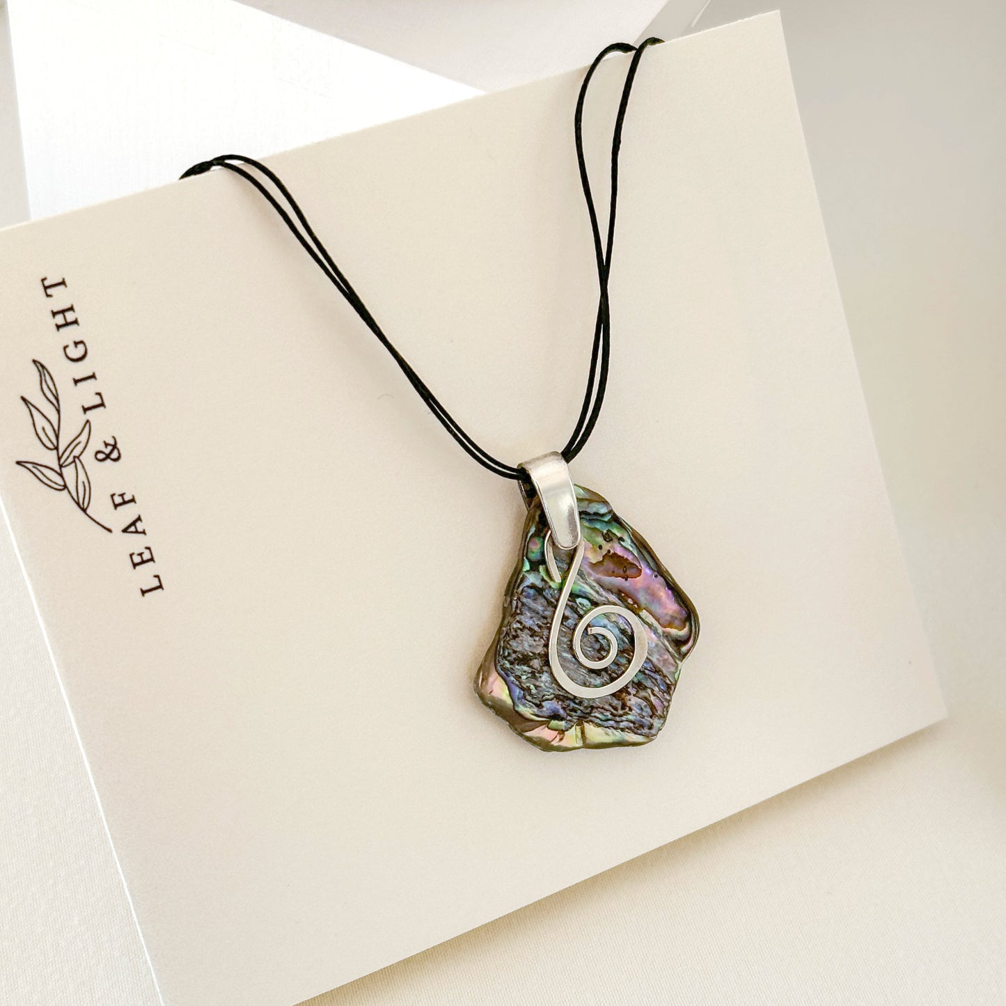 PĀUA AND STERLING SILVER NECKLACES WITH BAIL