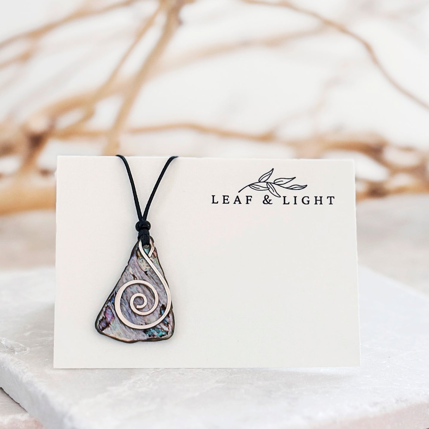 PĀUA AND STERLING NECKLACES