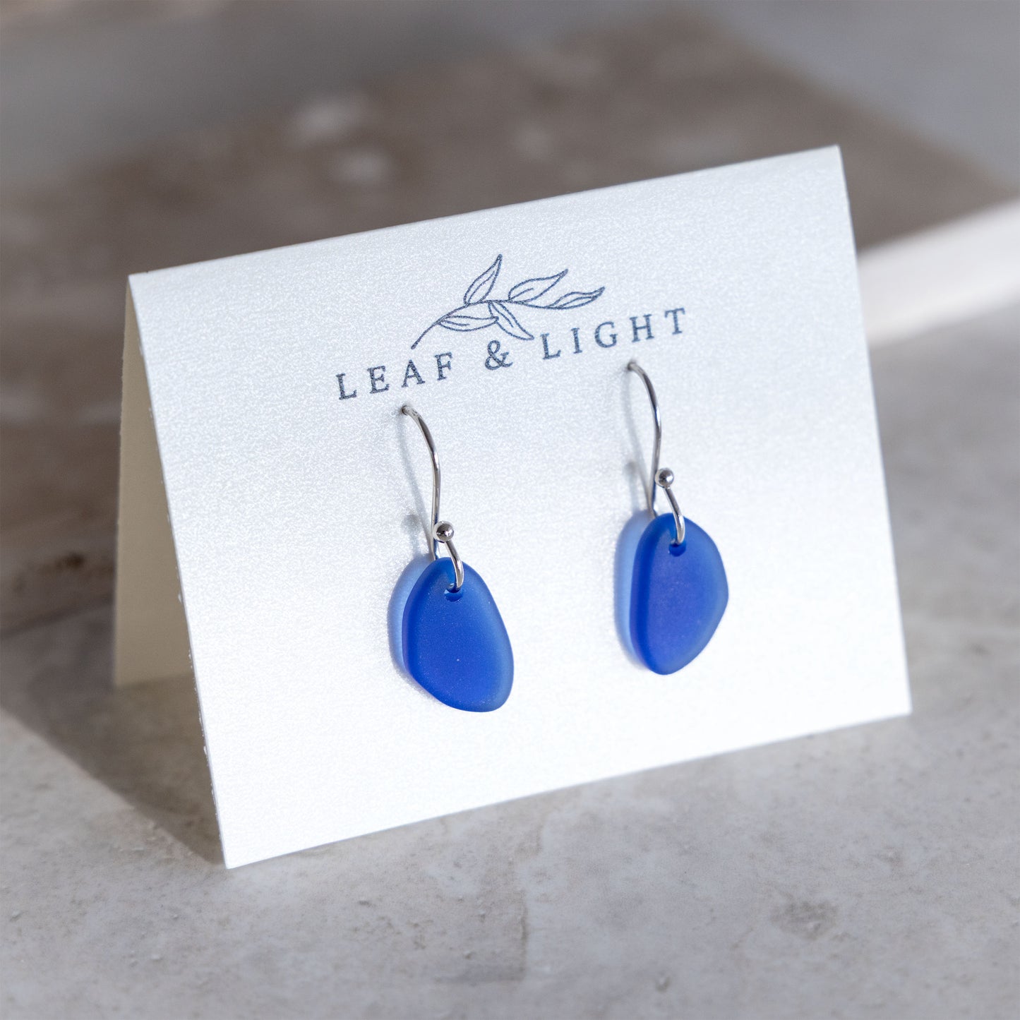 BLUE COASTAL GLASS DROP EARRINGS | SILVER PLATED