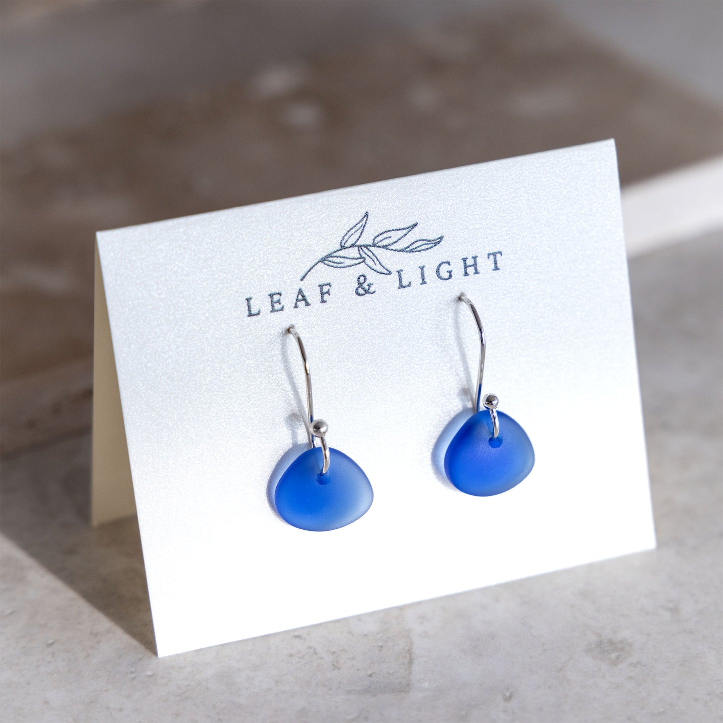 BLUE COASTAL GLASS DROP EARRINGS | SILVER PLATED